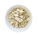 Pumpkin seeds bowl isolated on white Royalty Free Stock Photo
