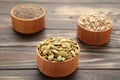 Pumpkin seeds, chia, sunflowers seeds in bowl on brown background Royalty Free Stock Photo