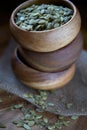 Pumpkin Seeds in Soft Light in Three Stacked Wood Bowls