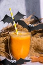 Pumpkin smoothie spiced latte. Fall Drinks for Halloween decorations with bat on straw. Holiday drink Autumn coffee with Royalty Free Stock Photo