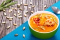 Pumpkin soup with bacon, walnut, pumpkin seeds and rozemary Royalty Free Stock Photo