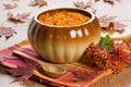 Pumpkin soup in ceramic pot Royalty Free Stock Photo