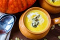 Pumpkin soup in clay pot Royalty Free Stock Photo