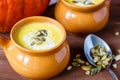 Pumpkin soup in a clay pot Royalty Free Stock Photo