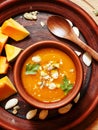 Pumpkin soup in a clay pot, top view Royalty Free Stock Photo