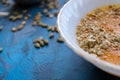 pumpkin soup with dill and young green onion feathers with toasted bread slices and pumpkin seeds Royalty Free Stock Photo