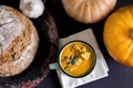 Pumpkin soup in a mug Royalty Free Stock Photo