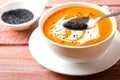 Pumpkin Soup with tomatoes, chili, yogurt and black sesame seeds