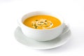 Pumpkin soup in white bowl isolated Royalty Free Stock Photo
