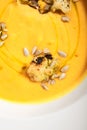 Pumpkin soup in white bowl Royalty Free Stock Photo