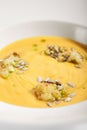 Pumpkin soup in white bowl Royalty Free Stock Photo