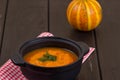 Pumpkin soup on a wooden table Royalty Free Stock Photo