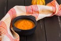 Pumpkin soup on a wooden table Royalty Free Stock Photo