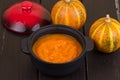 Pumpkin soup on a wooden table Royalty Free Stock Photo