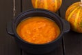 Pumpkin soup on a wooden table Royalty Free Stock Photo