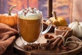 Pumpkin spice latte with autumn background Royalty Free Stock Photo