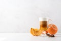 Pumpkin spice latte in a glass mug with cinnamon Royalty Free Stock Photo