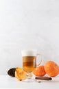 Pumpkin spice latte in a glass mug with cinnamon Royalty Free Stock Photo