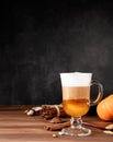Pumpkin spice latte in a glass mug with cinnamon and ginger Royalty Free Stock Photo