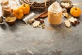 Pumpkin spice latte in a glass mug