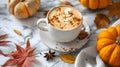 Pumpkin spice latte in glass mug with cinnamon, nutmeg, pumpkin seeds and whipped cream on brown texture wood. Royalty Free Stock Photo