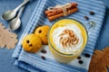 Pumpkin spice latte with whipped cream and pumpkin chocolate chi Royalty Free Stock Photo