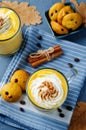 Pumpkin spice latte with whipped cream and pumpkin chocolate chi Royalty Free Stock Photo