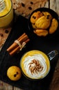 Pumpkin spice latte with whipped cream and pumpkin chocolate chi Royalty Free Stock Photo