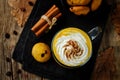 Pumpkin spice latte with whipped cream and pumpkin chocolate chi Royalty Free Stock Photo