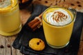 Pumpkin spice latte with whipped cream and pumpkin chocolate chi Royalty Free Stock Photo