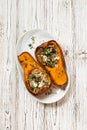 Pumpkin stuffed with quinoa, spinach and soft cheese