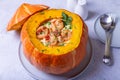 Pumpkin stuffed with shrimps and cheese, whole baked. Traditional Brazilian dish.