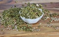 Pumpkin and sunflower seeds in a bowl and on the bench Royalty Free Stock Photo