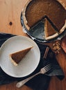 Pumpkin tart on rustic table, Happy Thanksgiving! Homemade pumpkin pie slice on stylish plate