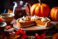 Pumpkin tart with whipped cream and caramel on a wooden background