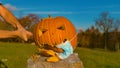 Pumpkin wearing Coronavirus face mask getting smashed with bat on Halloween