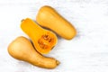 Pumpkin on a white table. Sweet Pear-shaped three Orange Pumpkin