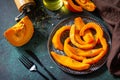 Pumpkin winter dessert. Baked pumpkin slices with honey and thyme.