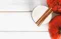 Pumpkin yogurt and cinnamon on a white background old wood. Royalty Free Stock Photo