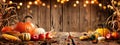 Pumpkins Apples And Corn On Rustic Harvest Table With Bokeh Lights