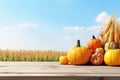 Pumpkins, Apples, And Corncobs On Wooden Table Under Clear Sky, Setting The Stage For Thanksgiving Royalty Free Stock Photo