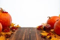 Pumpkins and autumn fruits, vegetables and berries on wooden table isolated on white background Royalty Free Stock Photo