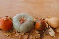 Pumpkins, autumn leaves, corn, walnuts,chestnuts,acorns border on rustic wooden table with space for text. Happy Thanksgiving. Royalty Free Stock Photo