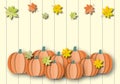 Pumpkins with colourful leaves on pastel wood background. Autumn or Thanksgiving and Halloween concept. Royalty Free Stock Photo