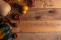 Pumpkins, cones and dry leaves on a wooden background, autumn composition, for congratulations on Thanksgiving Day, a holiday in Royalty Free Stock Photo