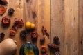 Pumpkins, cones and dry leaves on a wooden background, autumn composition, for congratulations on Thanksgiving Day, a holiday in Royalty Free Stock Photo