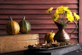 Pumpkins,copper jug with yellow chrysanthemums Royalty Free Stock Photo