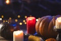 Pumpkins, corn cob and candles with copy space on dark background Royalty Free Stock Photo