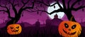 Pumpkins with faces in a graveyard with graves and bats hanging from the trees with a house on top of a mountain with purple night