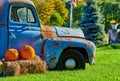 Pumpkins on a farm field near very old truck Royalty Free Stock Photo